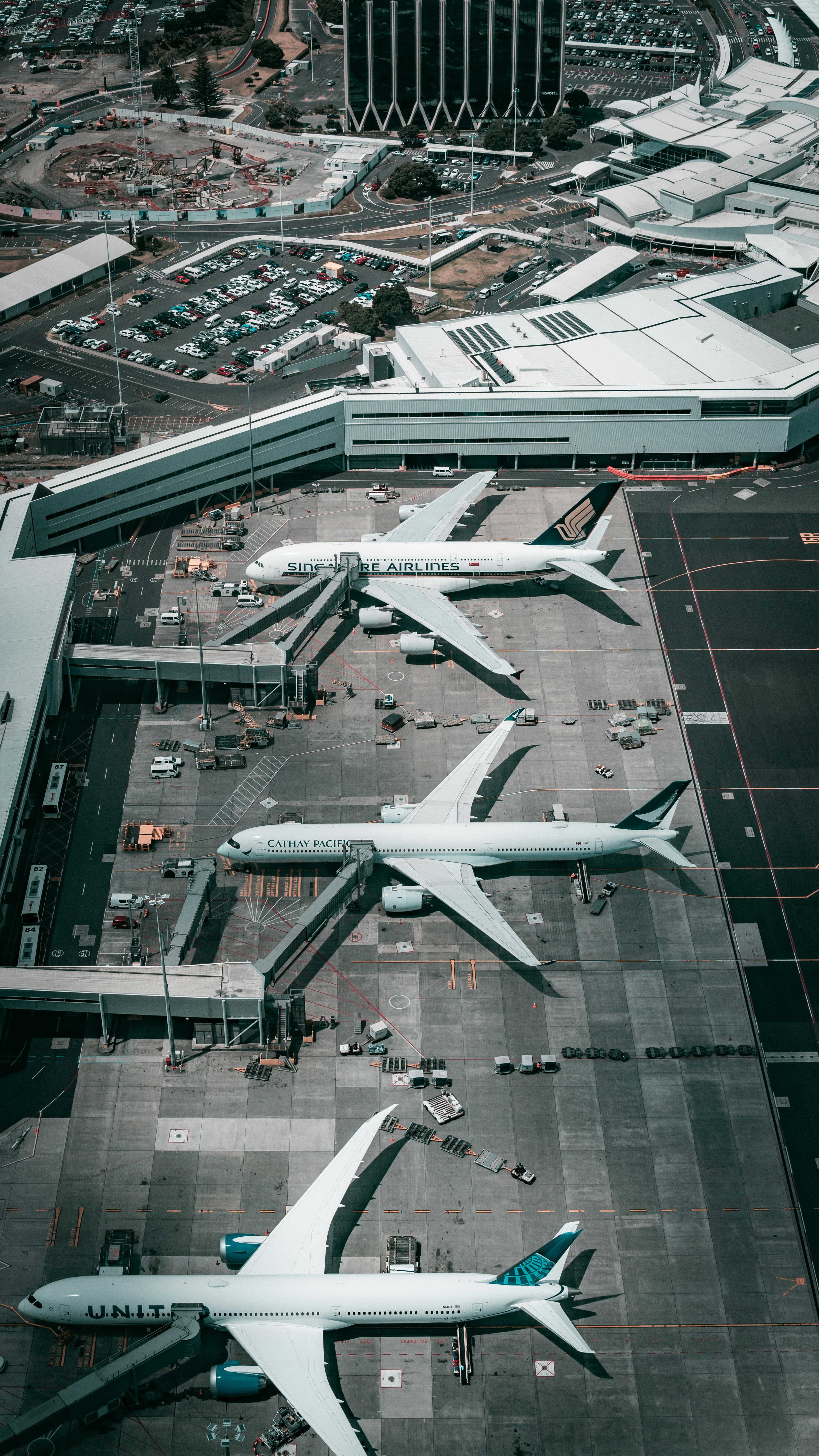 white and gray airplane on airport during daytime